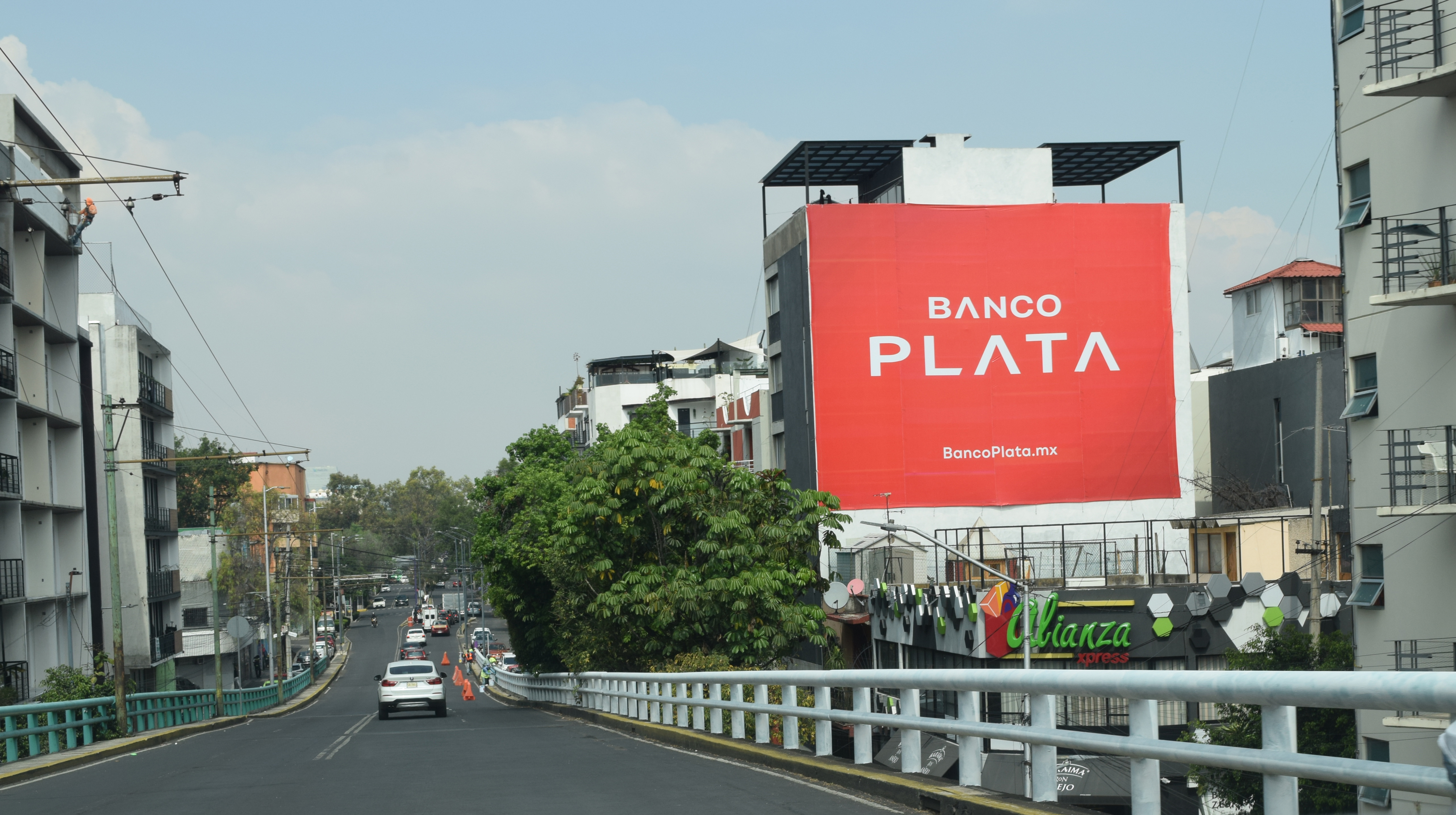 Banco Plata large-format advertising wall by BusBus, OOH outdoor advertising on an avenue in CDMX, Mexico